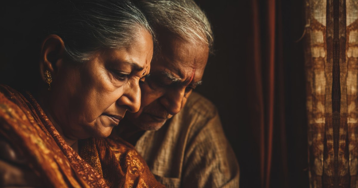 An elderly couple sitting together