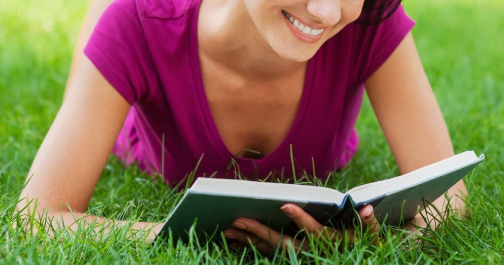 A woman finding inner freedom by reading a book in a peaceful room.