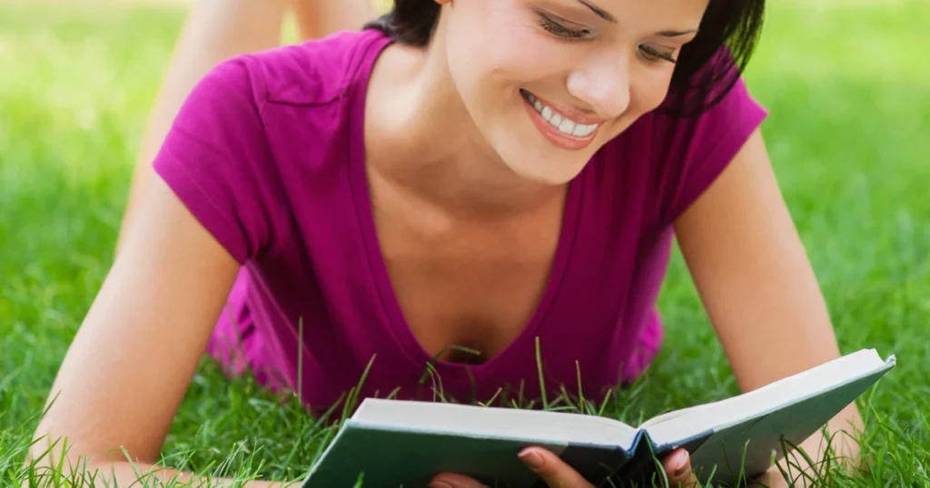 A woman finding inner freedom by reading a book in a peaceful room.